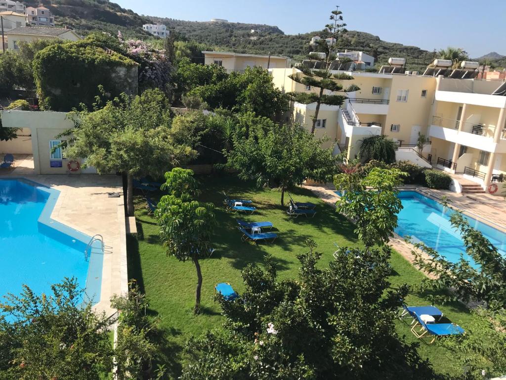 an aerial view of a resort with a swimming pool at Marakis in Platanias