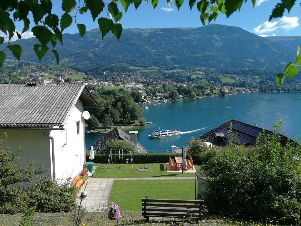 a house with a view of a lake at Ferienwohnung Kerschbaumer in Seeboden