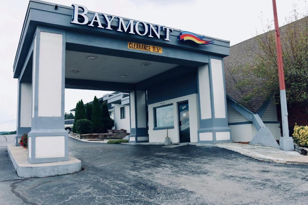 a building with a sign on the front of it at Baymont by Wyndham Cookeville in Cookeville