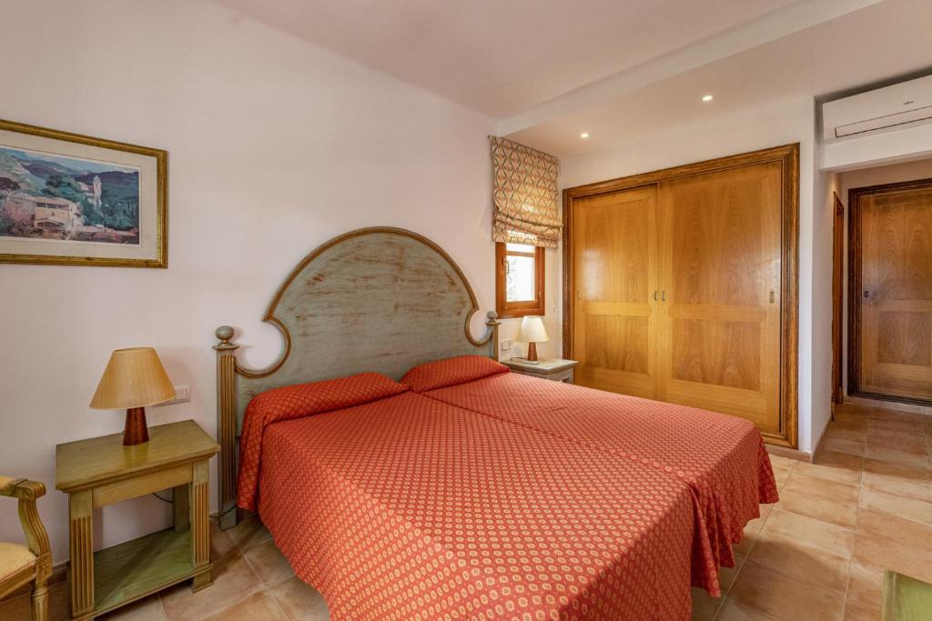 Postel nebo postele na pokoji v ubytování Villa Cala dor