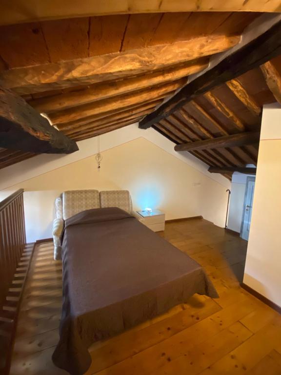 Łóżko lub łóżka w pokoju w obiekcie Le Casette nel Borgo
