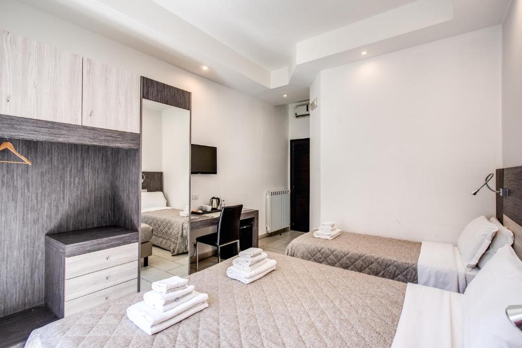 Posteľ alebo postele v izbe v ubytovaní Napoli Suite