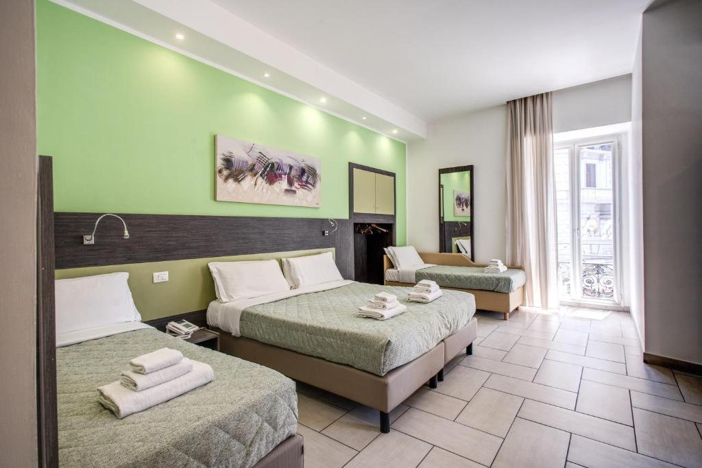 Posteľ alebo postele v izbe v ubytovaní Napoli Suite