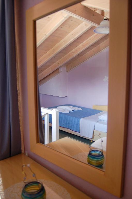 Postel nebo postele na pokoji v ubytování Angelina Apartments