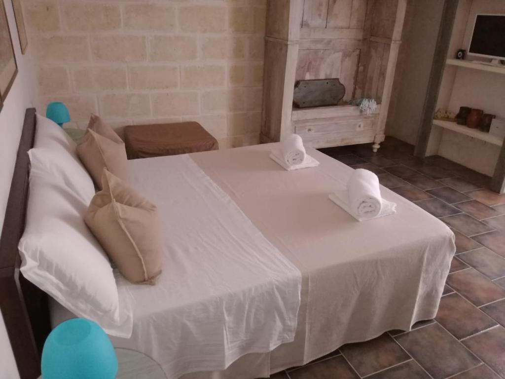 Giường trong phòng chung tại Le Biadelle - Country Boutique Apartments - Villa Laura Ostuni