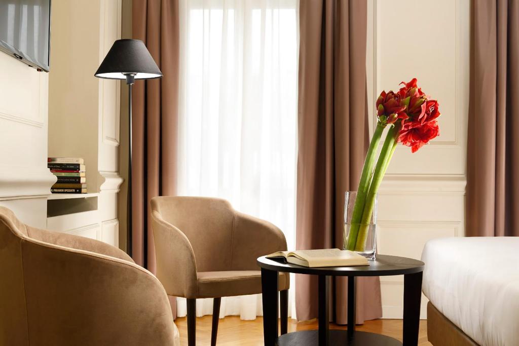 A bed or beds in a room at Splendor Suite Rome - Suites & Apartments