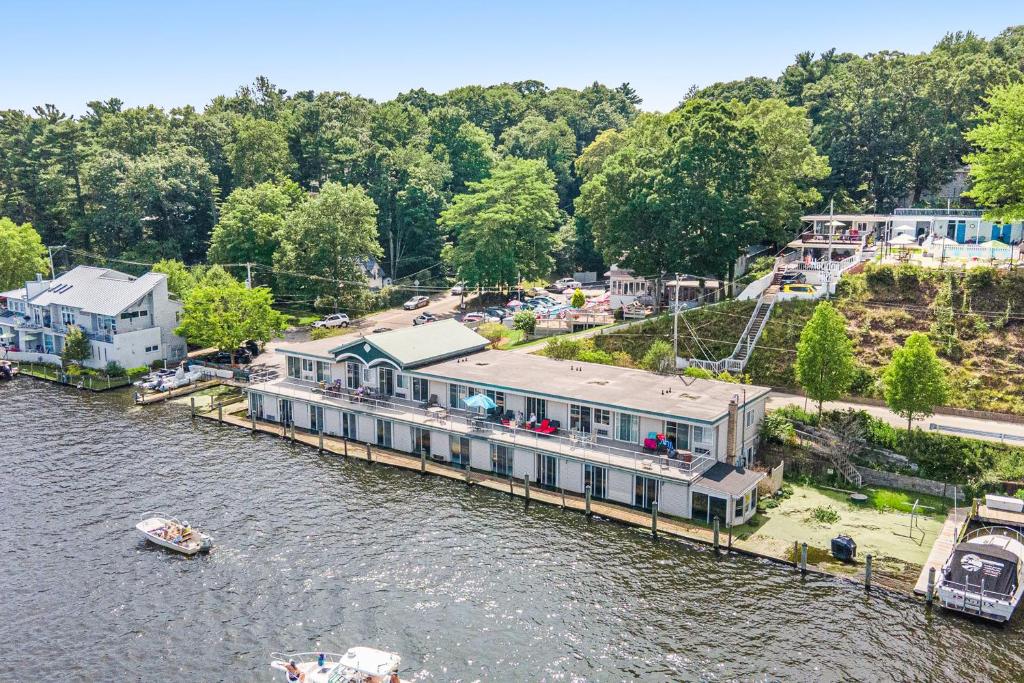 an aerial view of a house on a dock on a river at Waterside Suites in Saugatuck