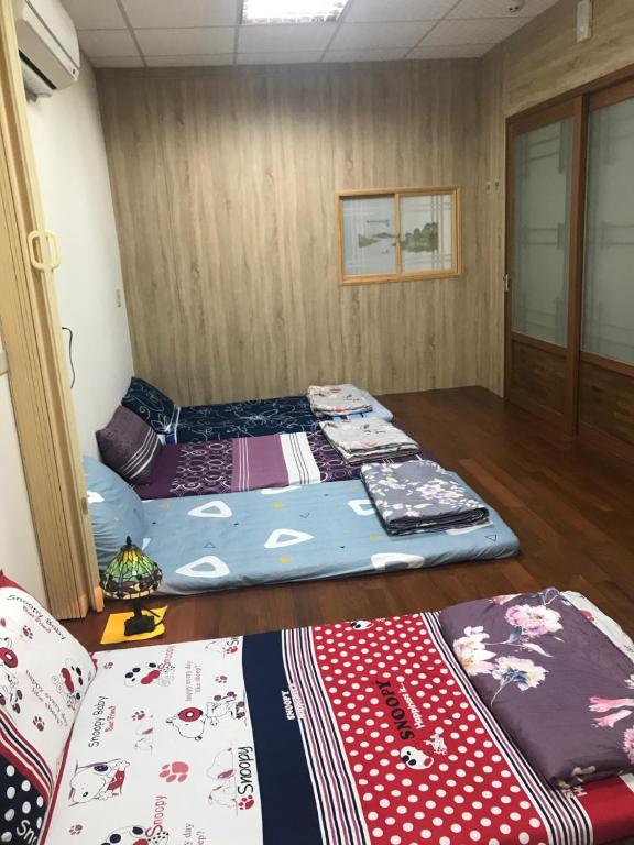 Postel nebo postele na pokoji v ubytování 枋寮枋居背包客棧Fang Ju Backpackers