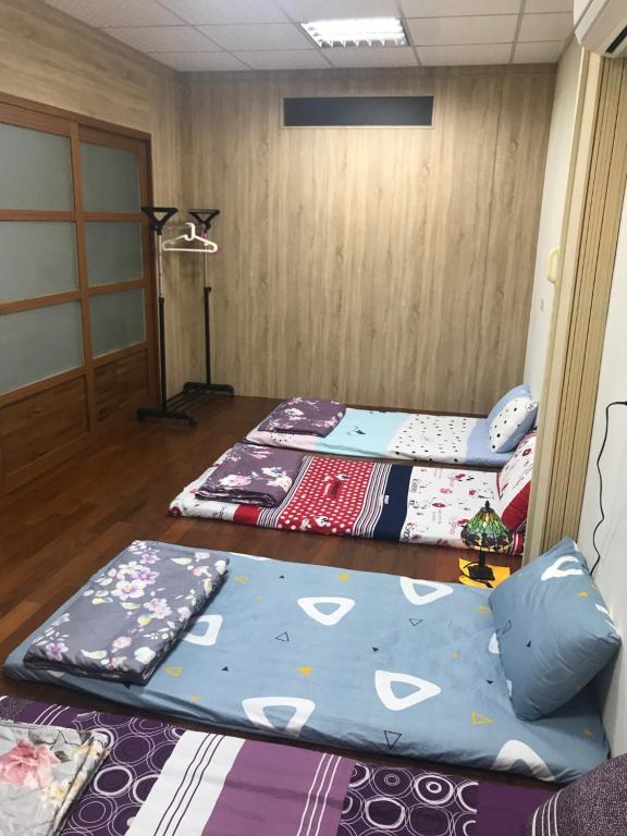 Postel nebo postele na pokoji v ubytování 枋寮枋居背包客棧Fang Ju Backpackers