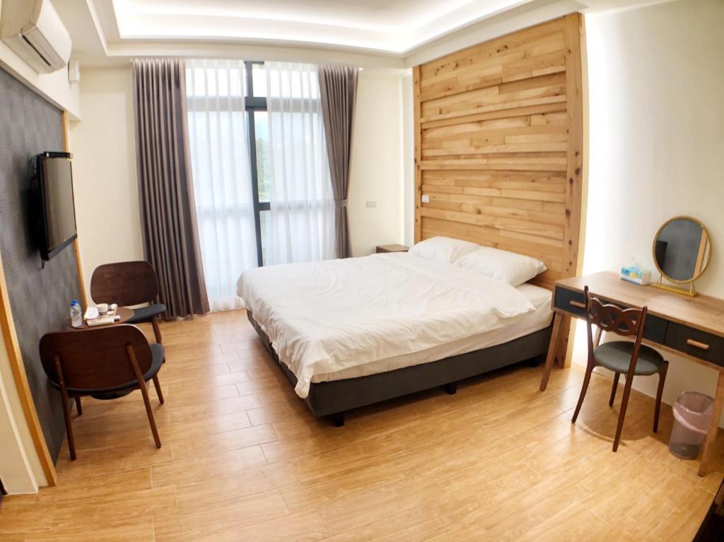 Postel nebo postele na pokoji v ubytování Alishan Zhuqi Homestay #57