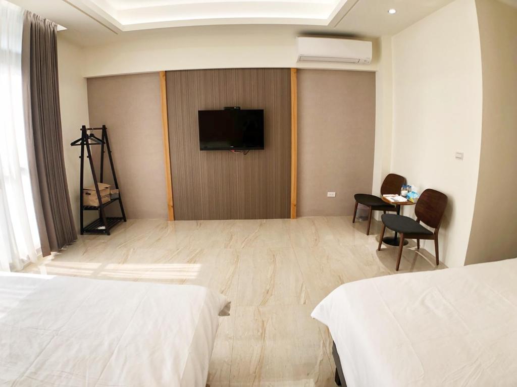 Postel nebo postele na pokoji v ubytování Alishan Zhuqi Homestay #57