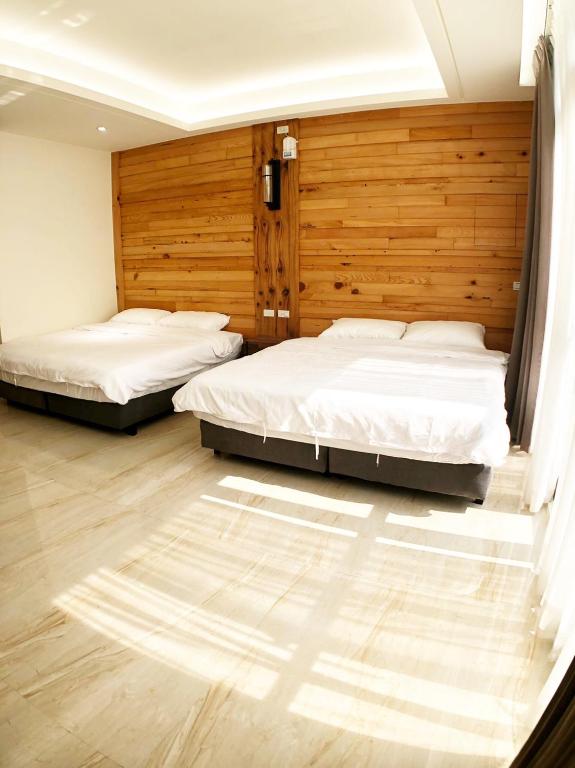 Postel nebo postele na pokoji v ubytování Alishan Zhuqi Homestay #57