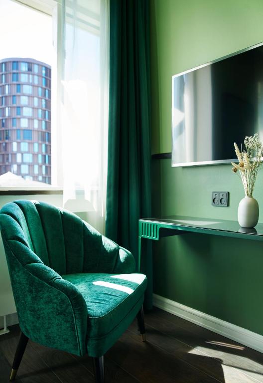 TV a/nebo společenská místnost v ubytování WIDE Hotel