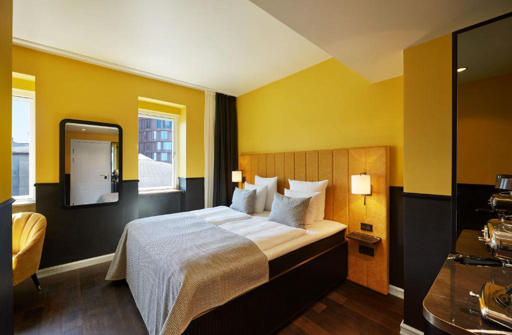 Postel nebo postele na pokoji v ubytování WIDE Hotel