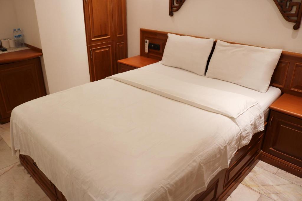 Postel nebo postele na pokoji v ubytování Max Residence