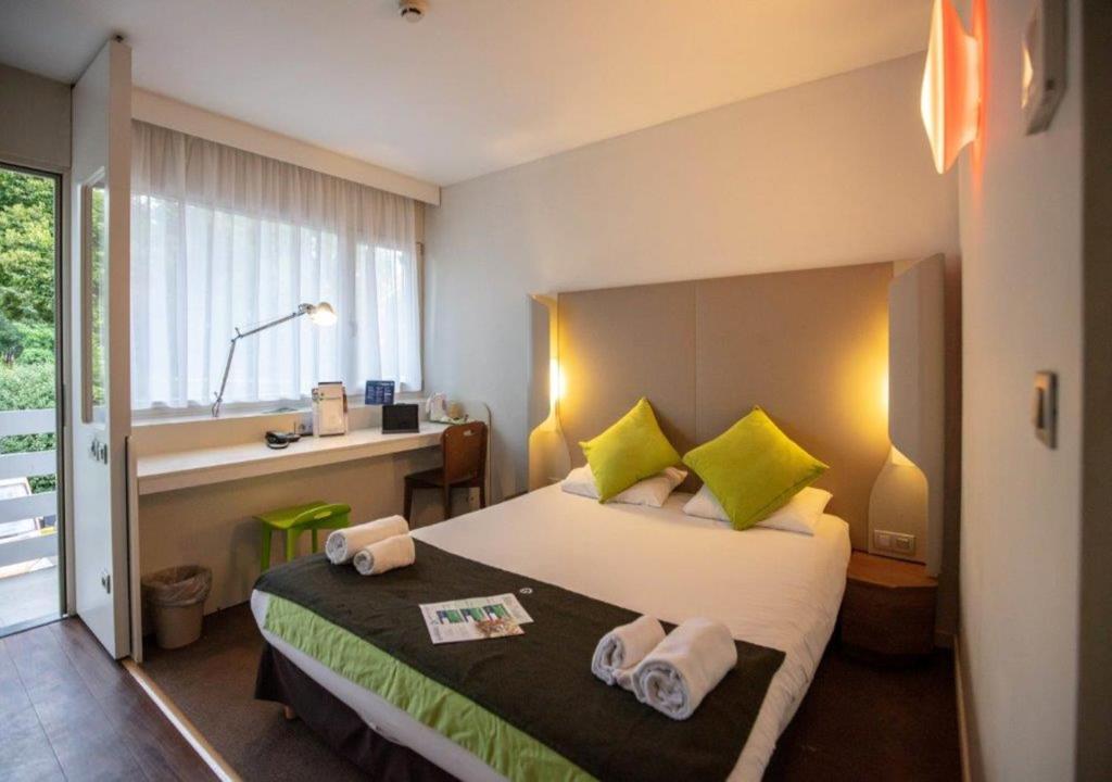 Postel nebo postele na pokoji v ubytování Campanile Hotel & Restaurant Liège / Luik