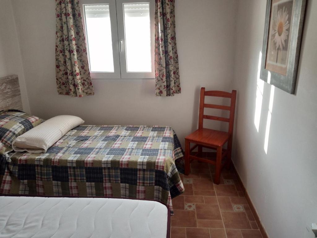 Postel nebo postele na pokoji v ubytování Cortijo Oliveras Moratalla