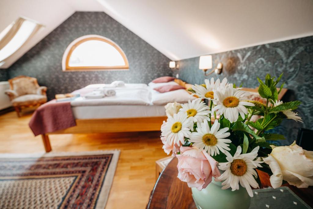 Postel nebo postele na pokoji v ubytování Hotel Klika