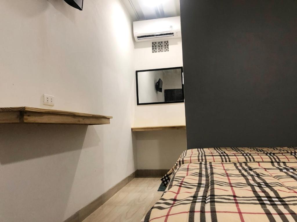 Postel nebo postele na pokoji v ubytování Bamboe Inn Homestay