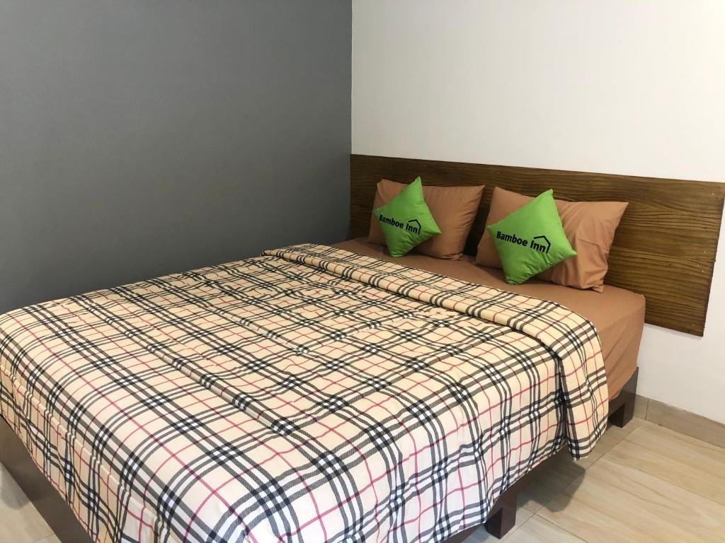 Postel nebo postele na pokoji v ubytování Bamboe Inn Homestay