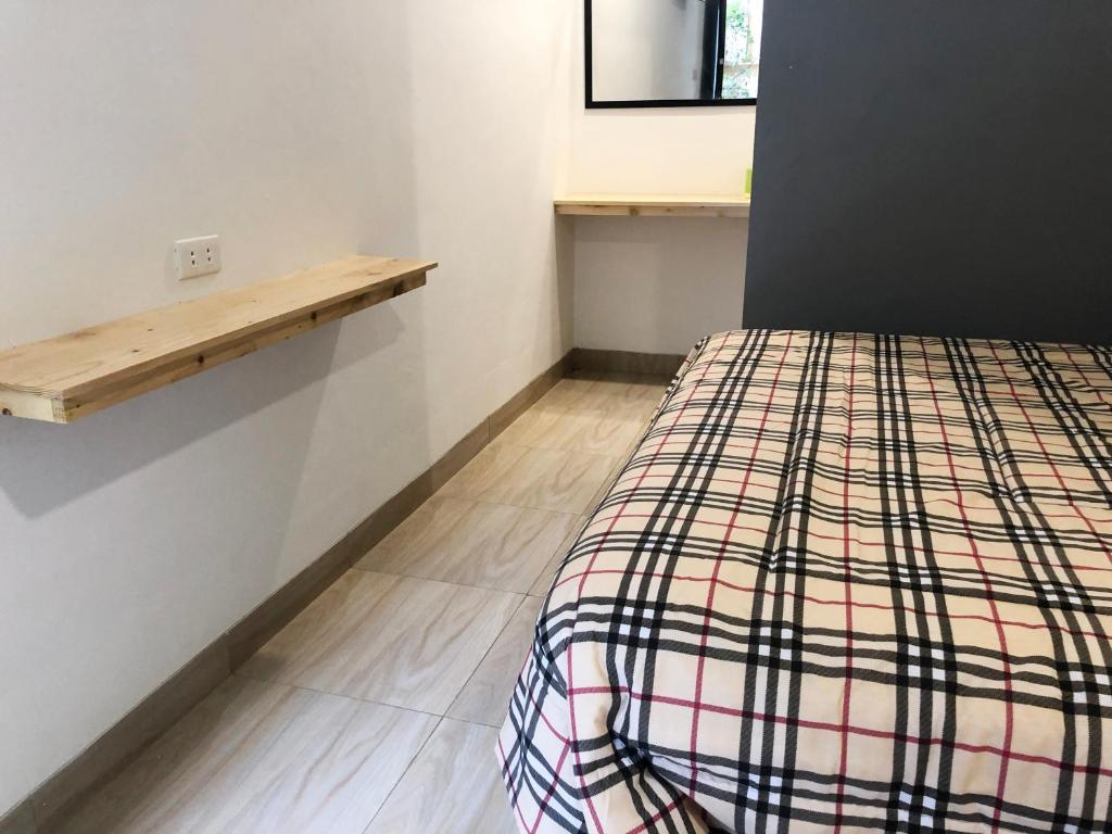Postel nebo postele na pokoji v ubytování Bamboe Inn Homestay