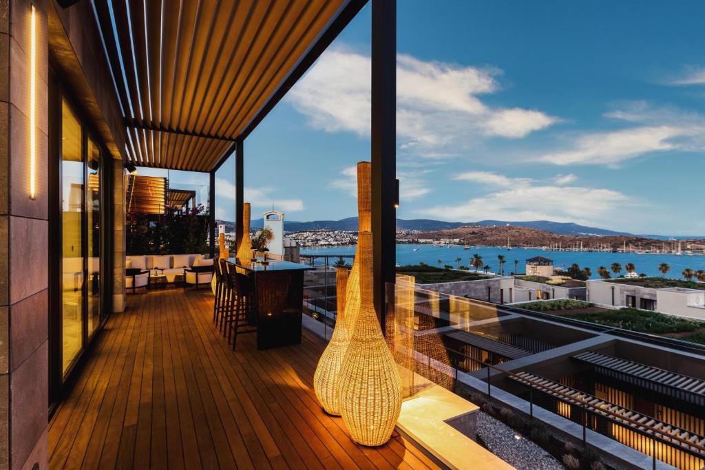 a balcony with a view of the water at Kaya Palazzo Resort & Residences Le Chic Bodrum in Bodrum City