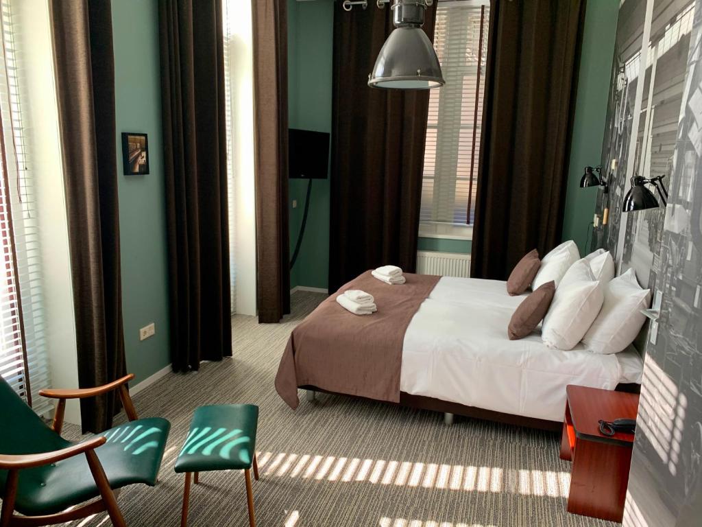 Postel nebo postele na pokoji v ubytování Hotel Nijver