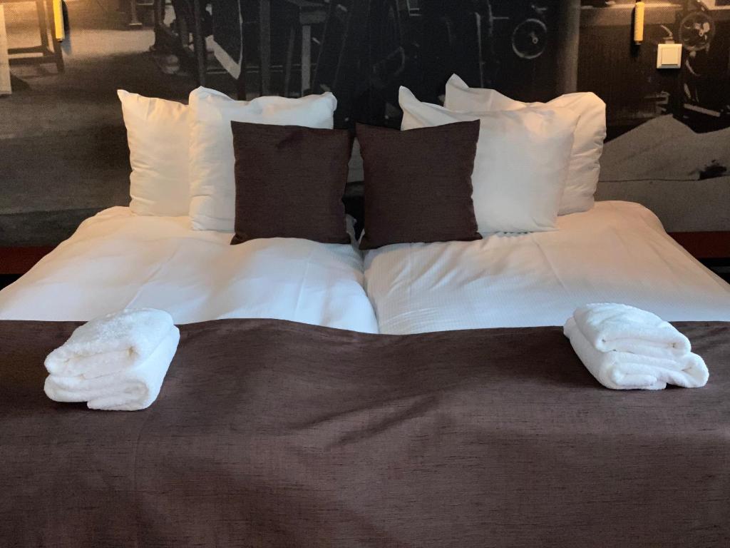 Postel nebo postele na pokoji v ubytování Hotel Nijver
