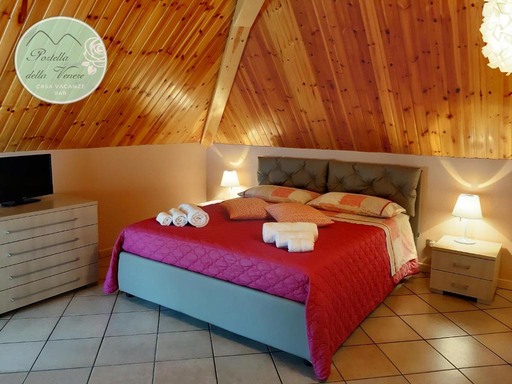 Postel nebo postele na pokoji v ubytování Portella della Venere