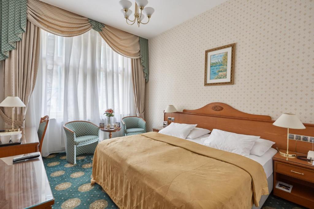 Voodi või voodid majutusasutuse Hotel Romance toas