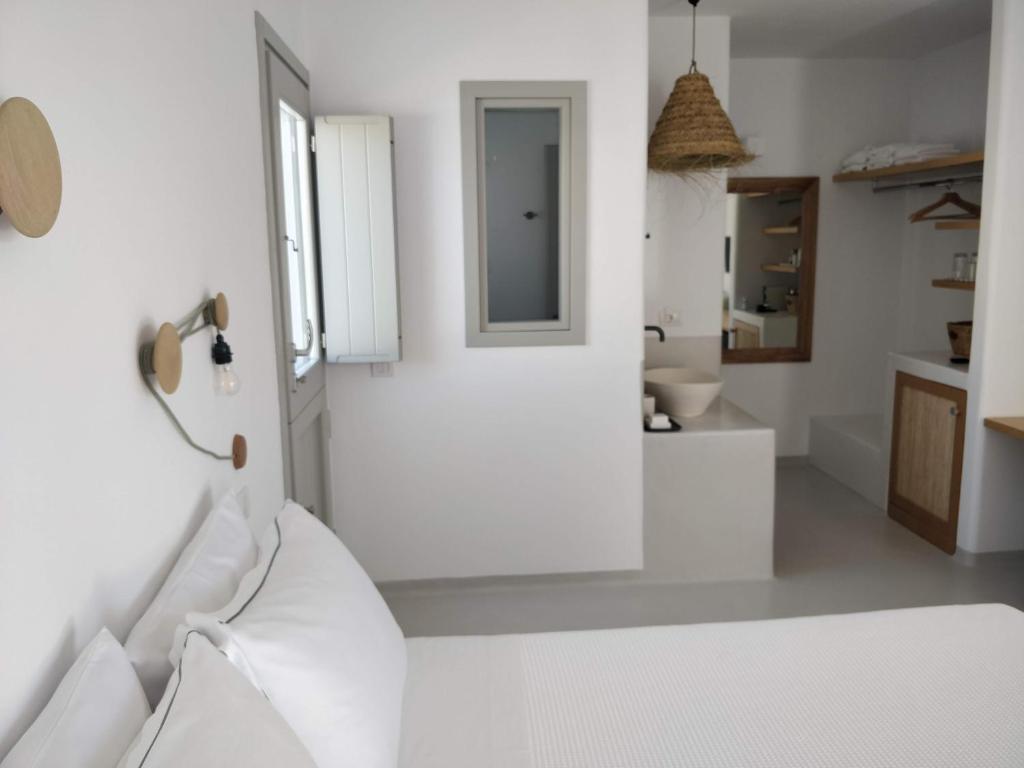 A bed or beds in a room at Psathaki