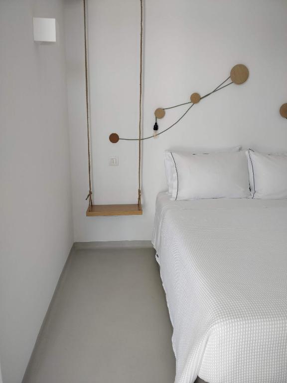 A bed or beds in a room at Psathaki