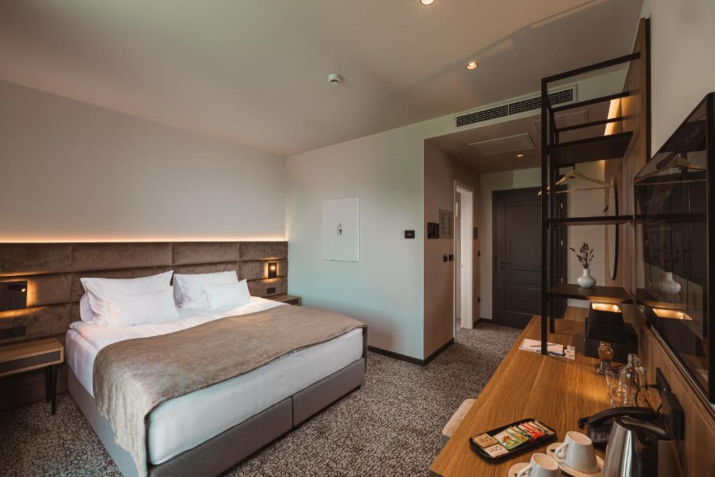 Postel nebo postele na pokoji v ubytování Hotel Grof