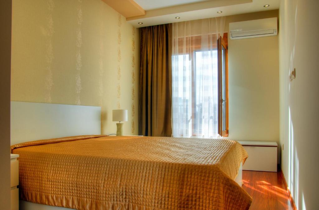 Postel nebo postele na pokoji v ubytování Apartments Athos