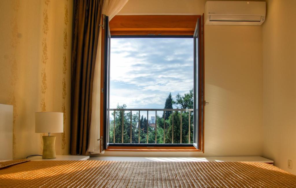 Postel nebo postele na pokoji v ubytování Apartments Athos