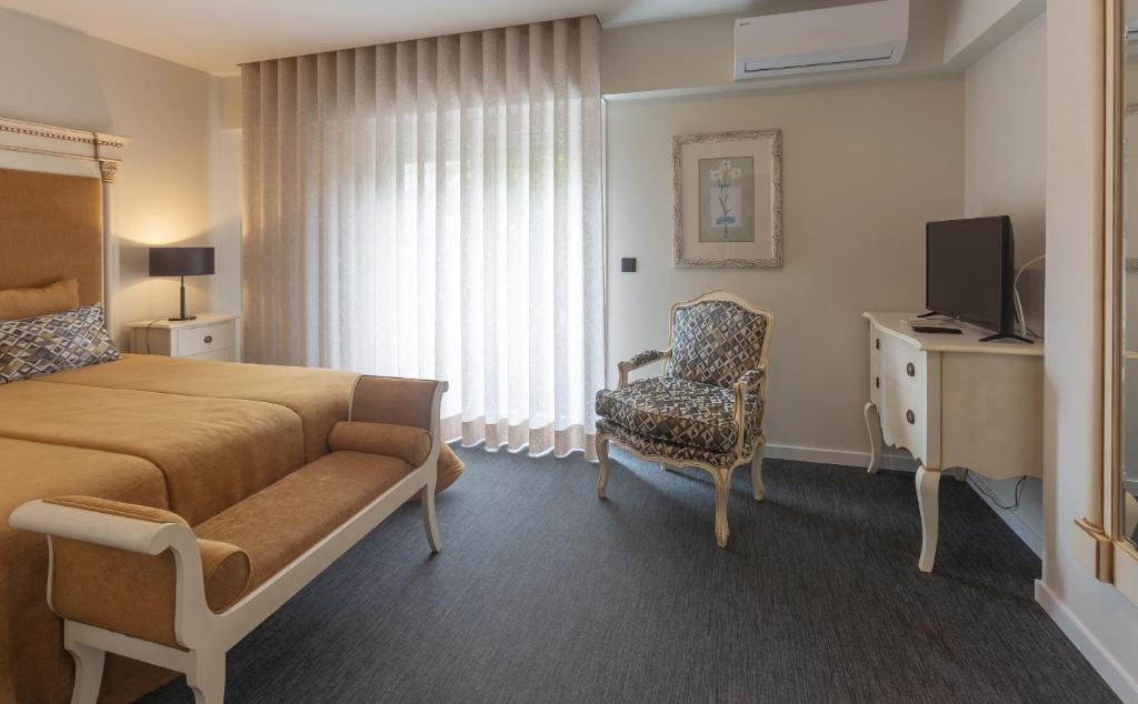Postel nebo postele na pokoji v ubytování Hotel Afonso V & SPA