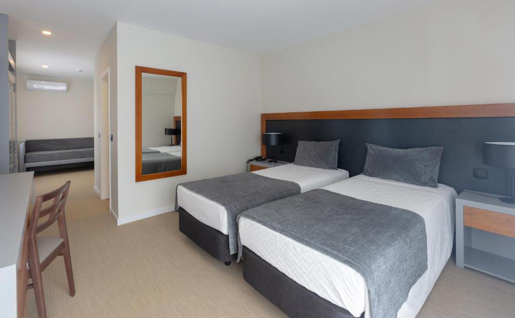 Postel nebo postele na pokoji v ubytování Hotel Afonso V & SPA