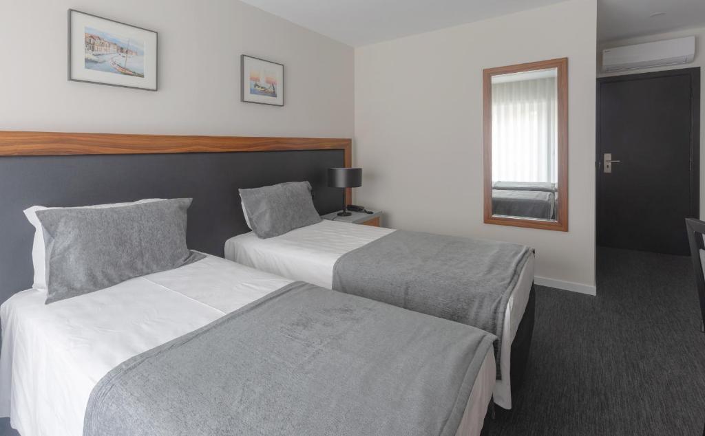 Postel nebo postele na pokoji v ubytování Hotel Afonso V & SPA