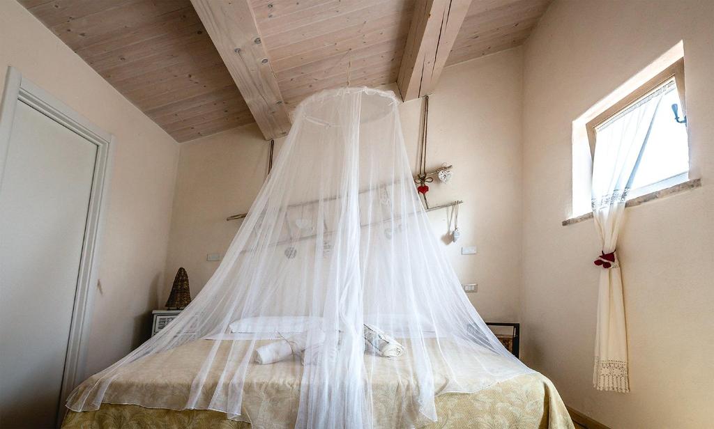 Postel nebo postele na pokoji v ubytování Colle Regnano