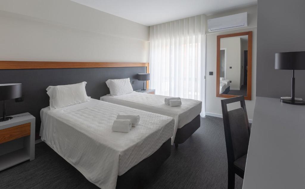 Postel nebo postele na pokoji v ubytování Hotel Afonso V & SPA