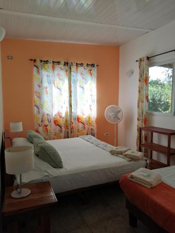 Postel nebo postele na pokoji v ubytování CASITA COLIBRIS
