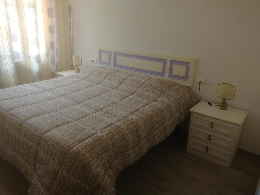 Łóżko lub łóżka w pokoju w obiekcie CASA ANTONIETTA