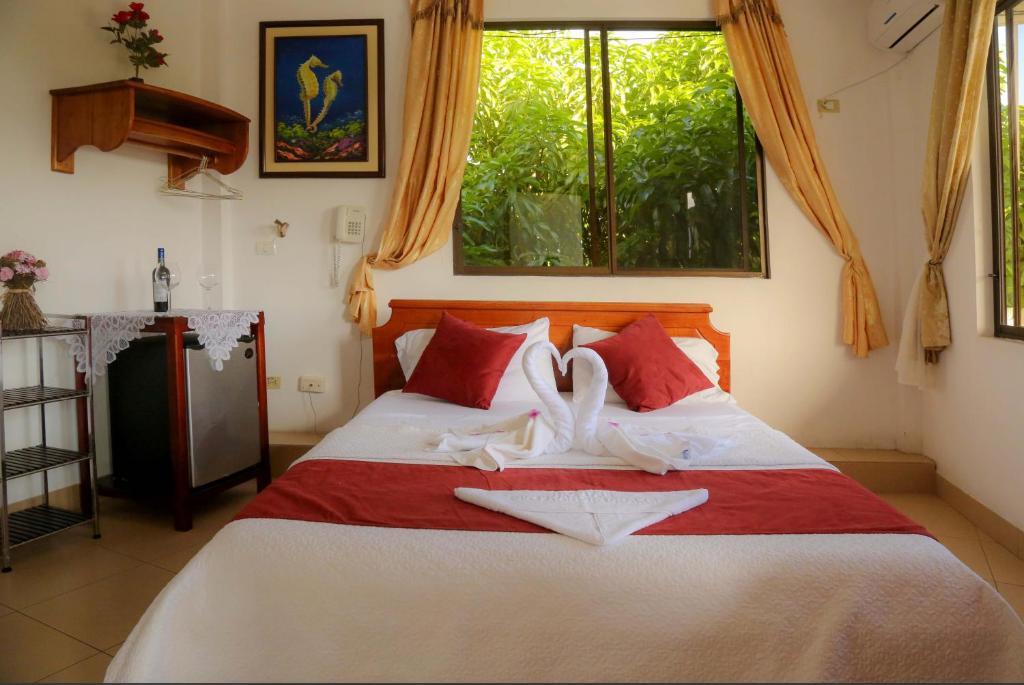 Postel nebo postele na pokoji v ubytování Hostal Sir Francis Drake