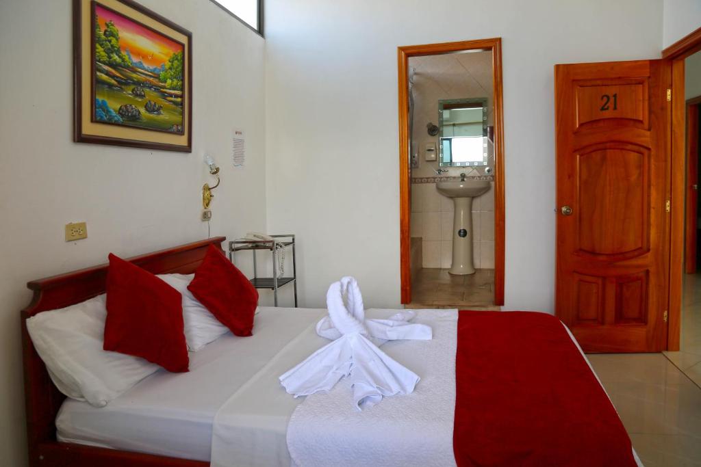 Postel nebo postele na pokoji v ubytování Hostal Sir Francis Drake