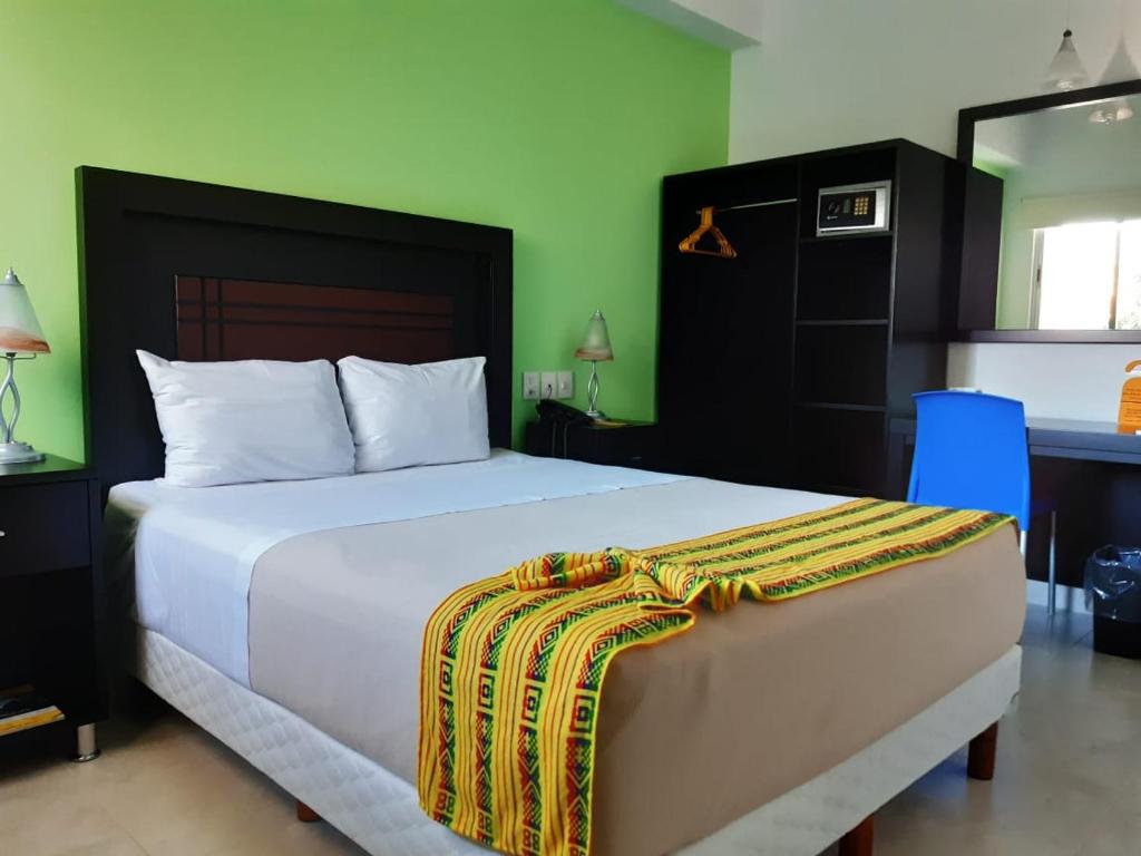 מיטה או מיטות בחדר ב-Hotel Parque Marimba