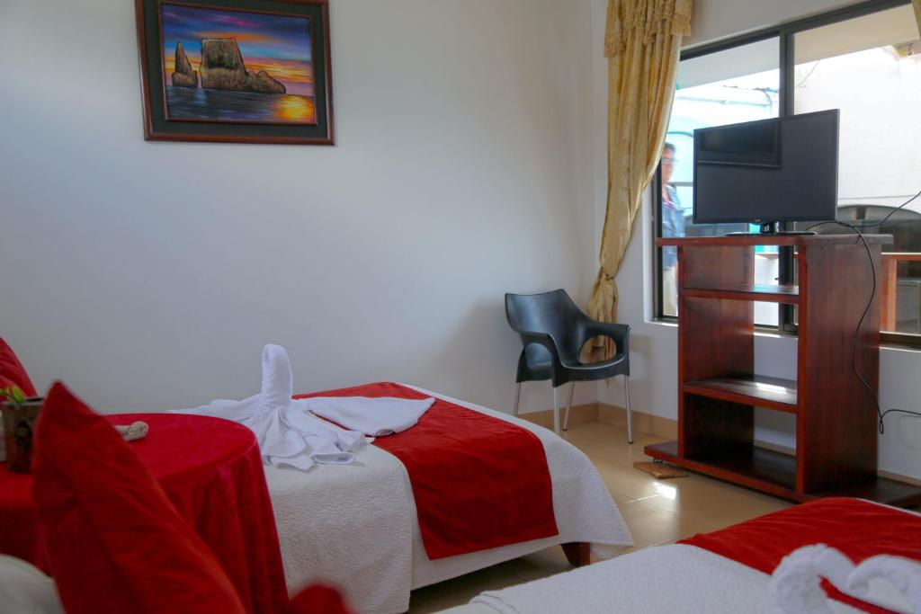 Postel nebo postele na pokoji v ubytování Hostal Sir Francis Drake