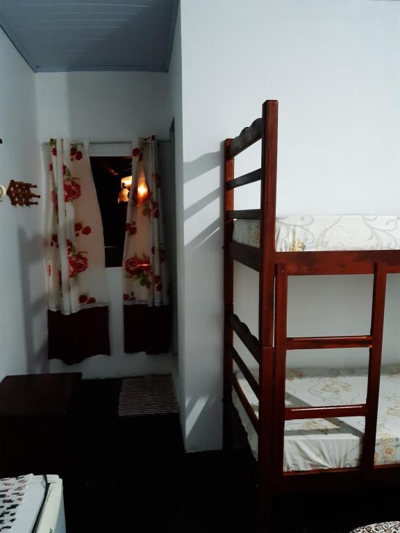 Postel nebo postele na pokoji v ubytování Pousada da Helena Trindade