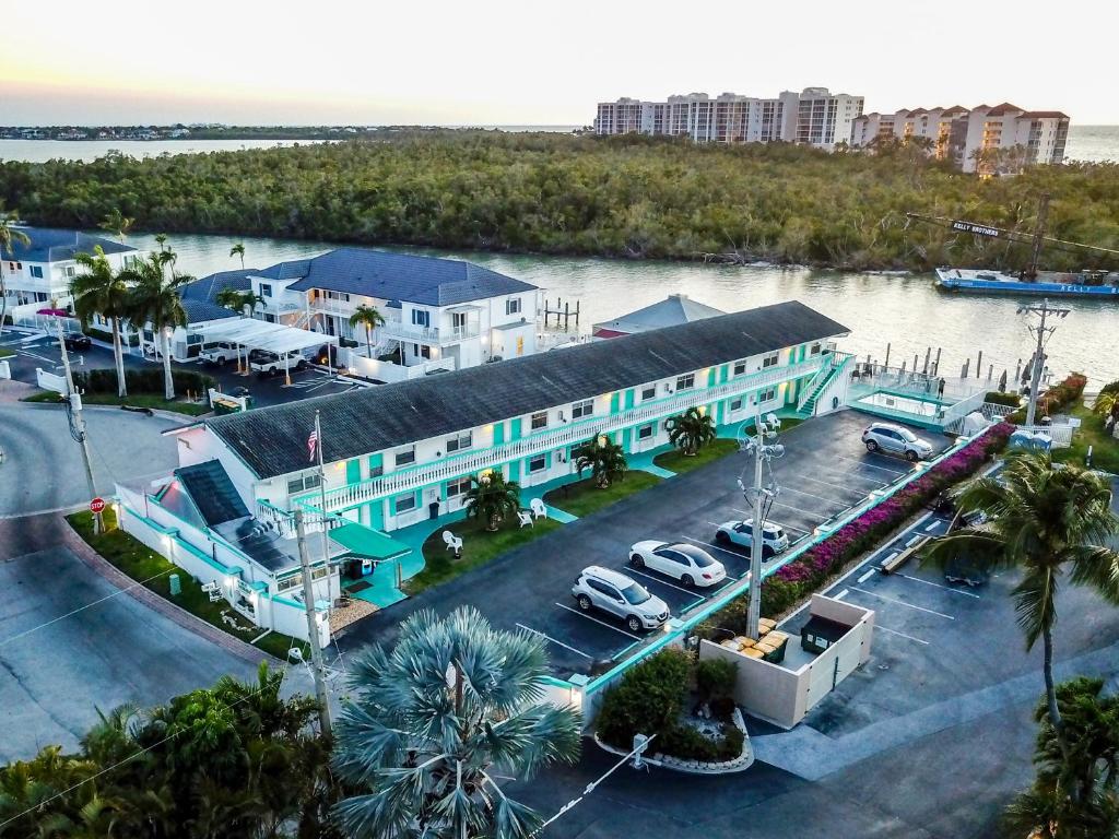 an aerial view of a building with a parking lot at The BoatHouse in Marco Island