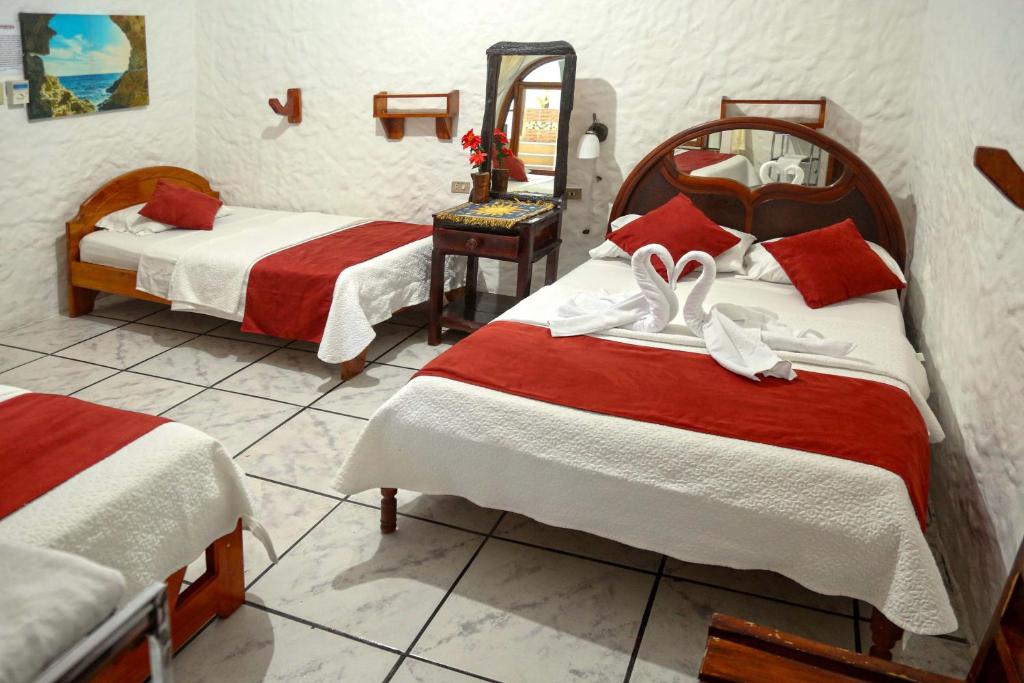 Postel nebo postele na pokoji v ubytování Hostal Sir Francis Drake