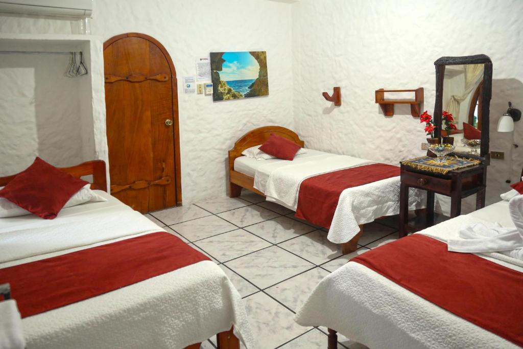 Postel nebo postele na pokoji v ubytování Hostal Sir Francis Drake